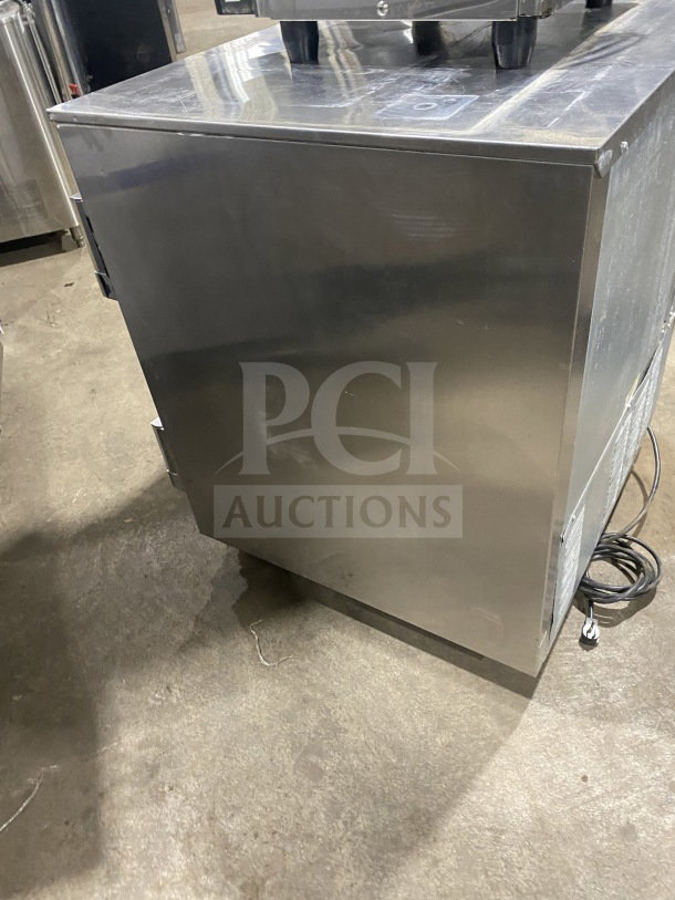 Beverage-Air UCR27Y stainless steel undercounter refrigerator, single door, on casters, with poly coated wired rack.