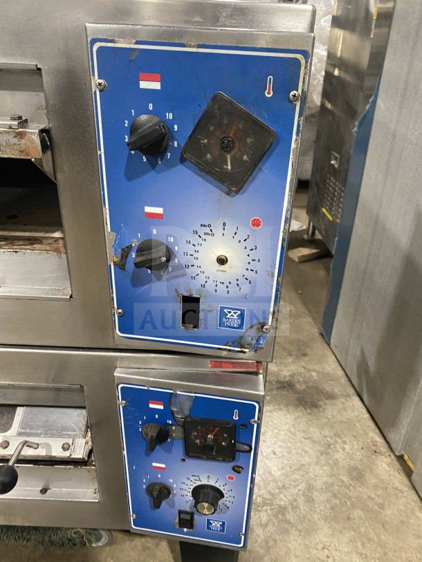 Bakers Pride double deck pizza oven, stainless steel, electric, on casters and legs, visible wear, dual control panels.