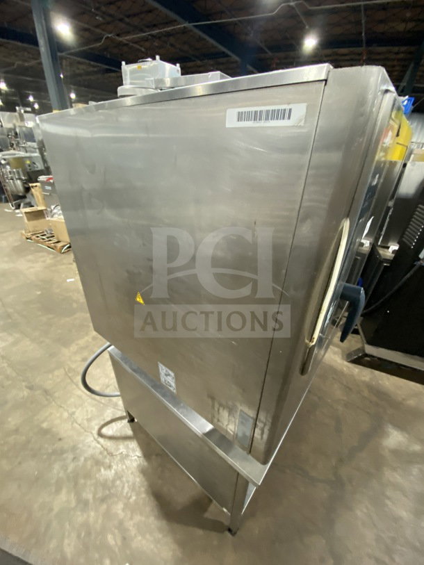 Rational White Efficiency Series combi convection oven with two-section pan stand, wired oven rack, natural power, on legs.