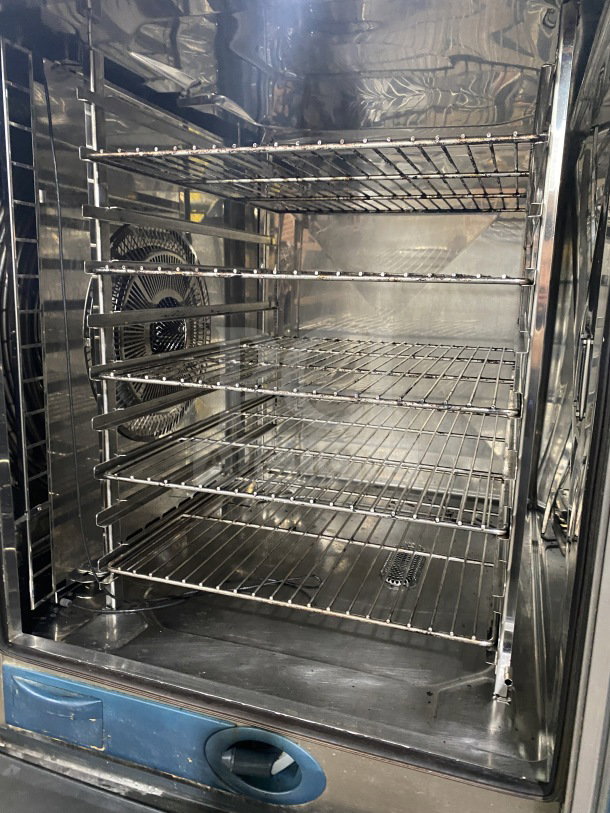 Rational White Efficiency Series combi convection oven, features wired oven rack, 2-section pan-holding stand, excellent condition.