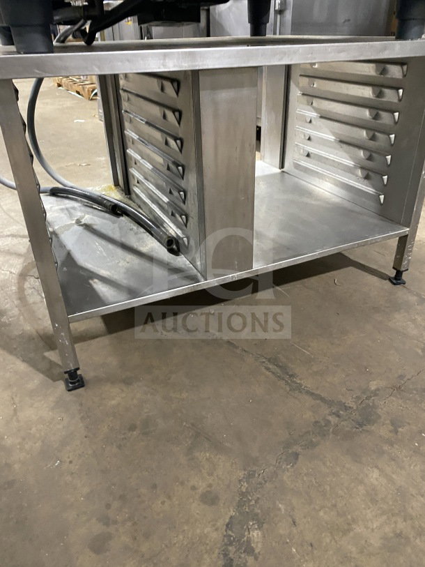 Rational White Efficiency Series combi convection oven with pan-holding base, wired rack, and on legs. Good condition.