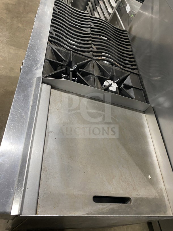 Southbend 6-burner range with 24" flat griddle, dual ovens, poly wired racks, and casters. Stainless steel, commercial use.