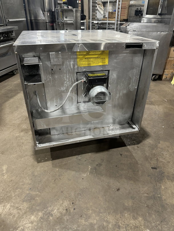 USRange commercial stainless steel gas convection oven, simple controls, wired oven rack, visible vents, and warning label.