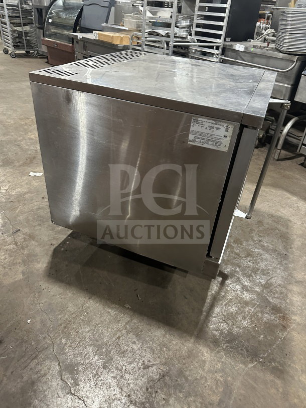 USRange commercial stainless steel convection oven, gas-powered, with a simple control panel and wired oven rack, in used condition.