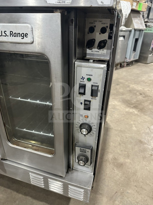 USRange commercial stainless steel convection oven, gas-powered, with simple controls and wired oven rack, in used condition.