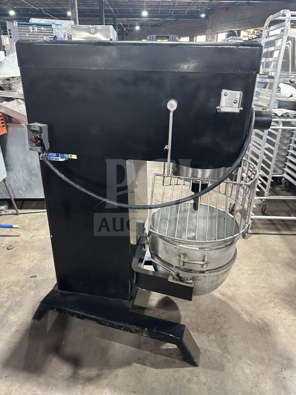 Blakeslee commercial black electric planetary mixer with stainless steel bowl guard, mixing bowl, and spiral hook attachment.