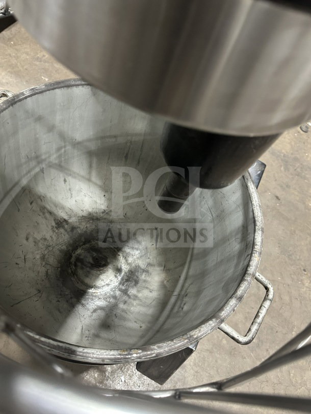 Blakeslee commercial planetary mixer with stainless steel bowl guard, mixing bowl, and spiral hook attachment.