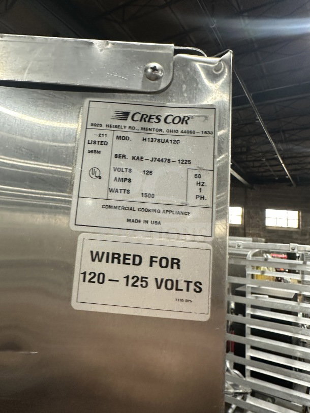 CresCor Model H137SUA12C commercial stainless steel 2-door heated cabinet, 120/125V, serial KAEJ744781225, on casters.