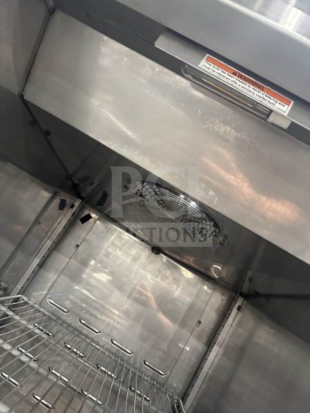 Hoshizaki CR1SFSL commercial stainless steel refrigerator interior, poly coated wire rack, warning label visible.