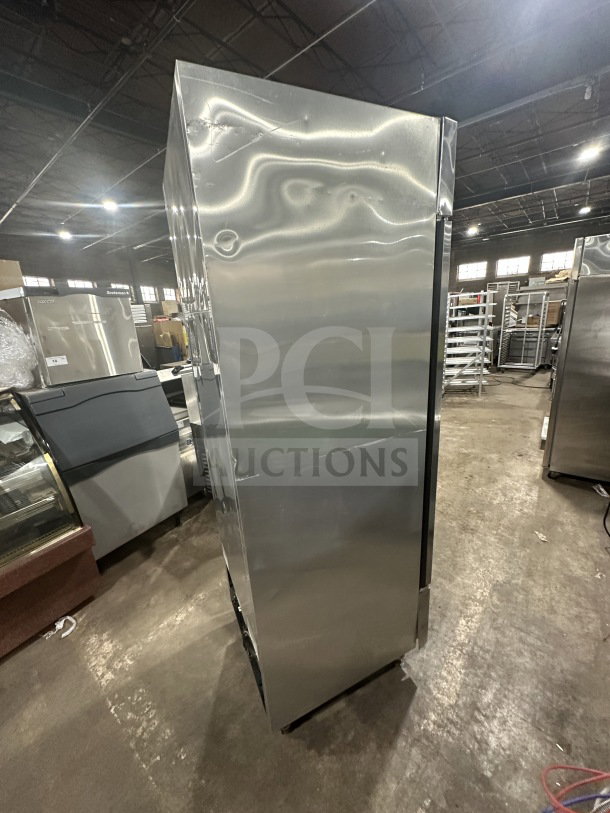 True T23FHC single door freezer, stainless steel, electric, poly coated wire rack, on casters, model SN: 8715275, 115V.