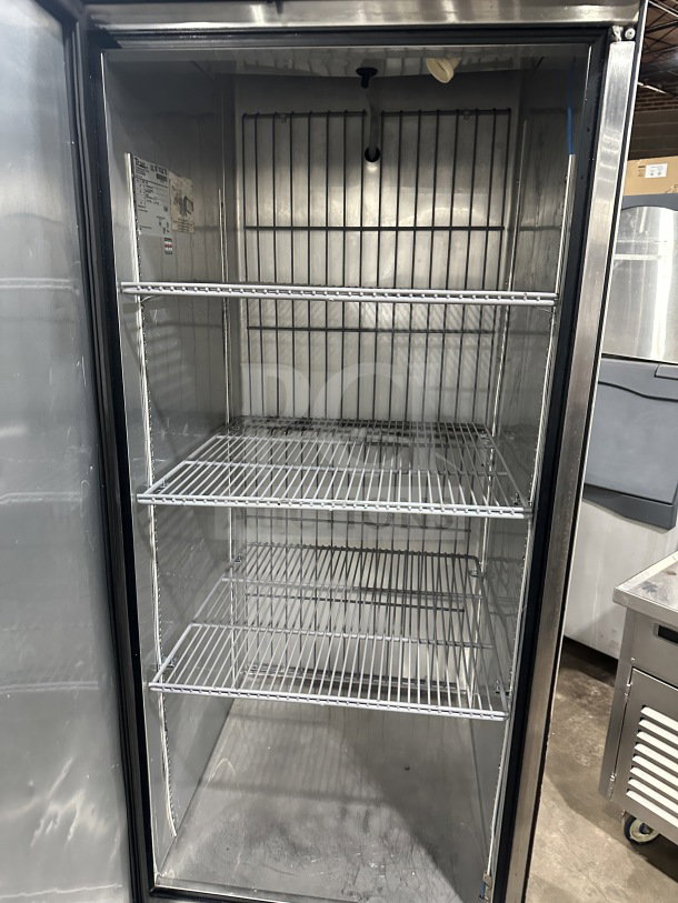 True T23FHC single door stainless steel freezer, electric-powered, with poly coated racks, on casters. Serial: 8715275.