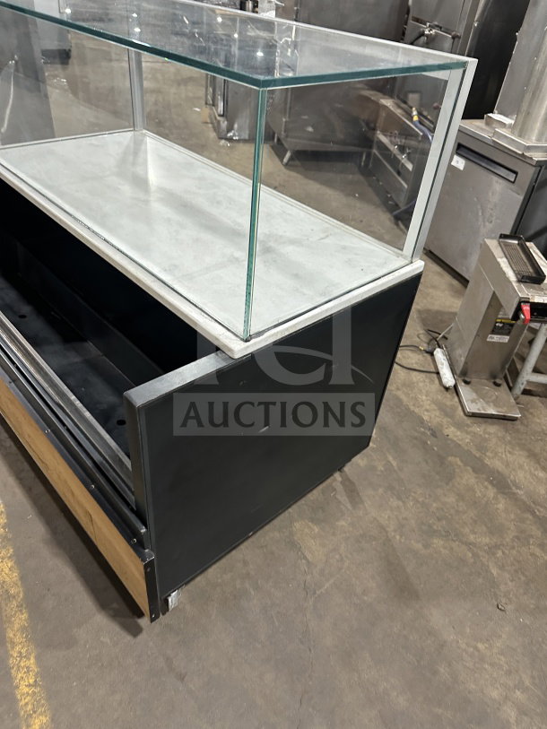 Structural Concepts SB25452DR black refrigerated open merchandiser, glass showcase on top, rear sliding doors, good condition.