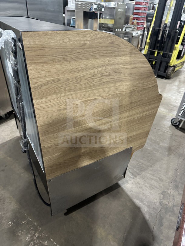 Federal Industries commercial refrigerated display case, model LPRSS4, with stainless steel shelves and wooden pattern body.
