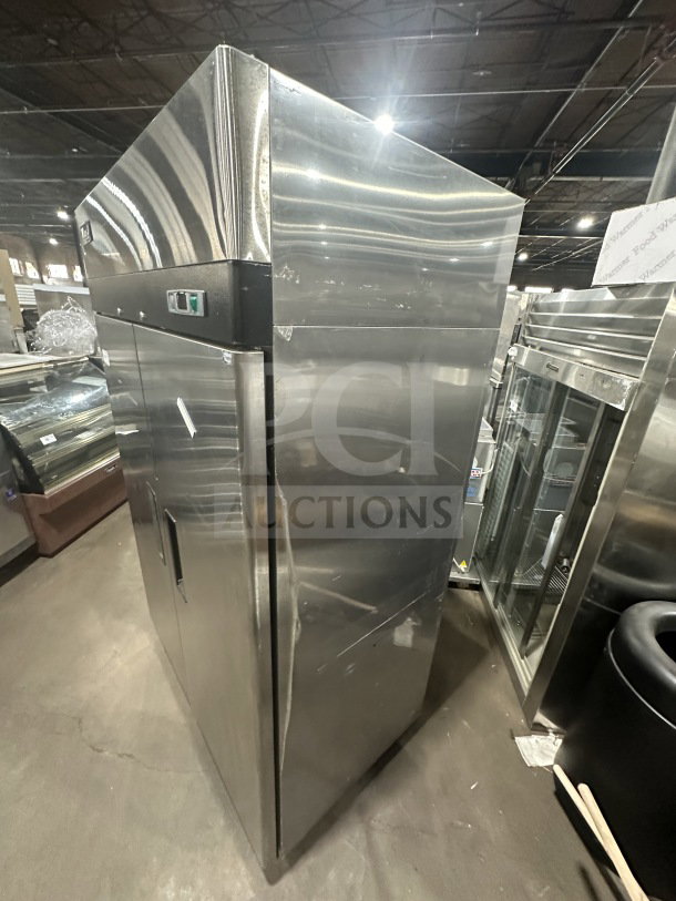 Migali T-Series C27 commercial reach-in stainless steel 2-door freezer, model C-2F, on casters. Features poly-coated wired rack.