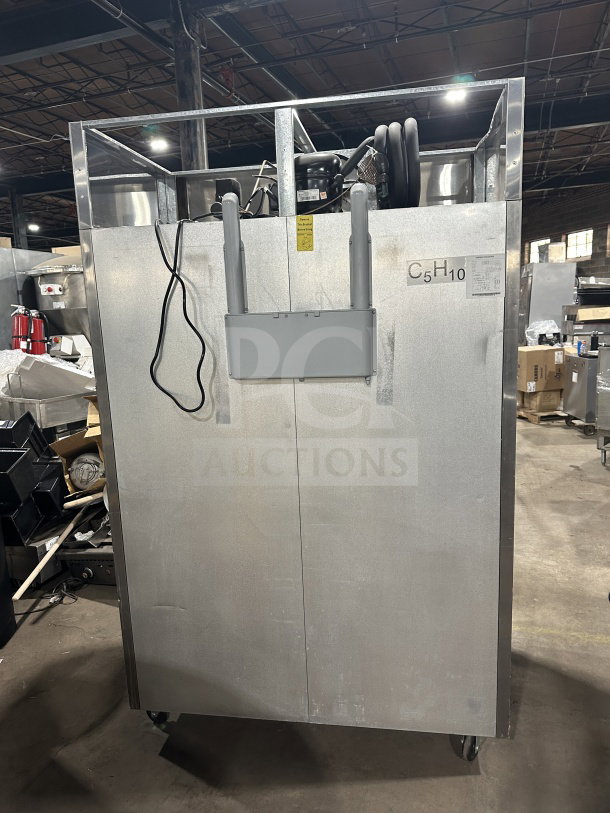 Migali T-Series C-2F commercial reach-in stainless steel 2-door freezer, poly coated wired rack, on casters, 115V, model C27.