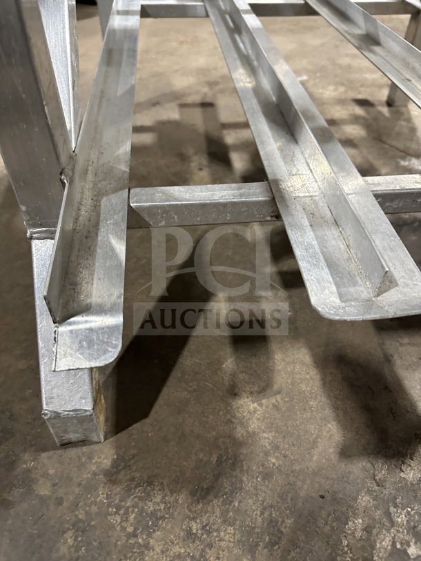 WinHolt CR-162 commercial stainless steel can storage rack, in good used condition, sturdy frame, ideal for kitchen storage.