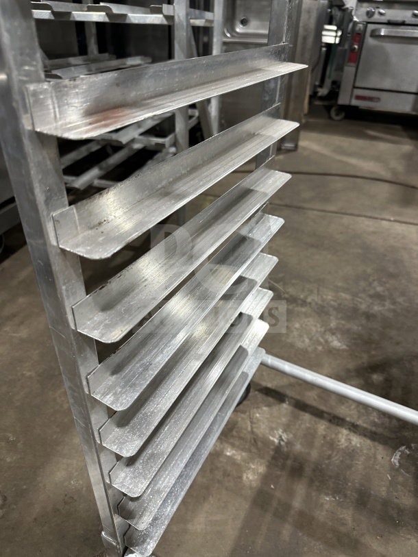 Regency Space Solutions commercial stainless steel pan rack, heavy-duty, multiple shelves, stainless steel, good condition.