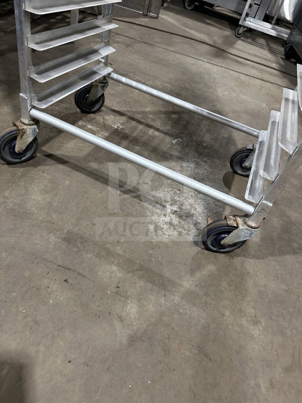 Regency Space Solutions stainless steel pan rack, rolling casters, 10-tier, heavy-duty, used condition.