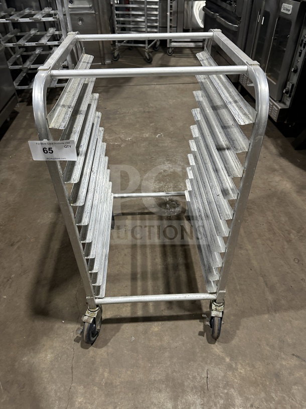 Commercial stainless steel bun pan rack on casters, holds multiple pans, durable, small-size, heavy-duty construction.