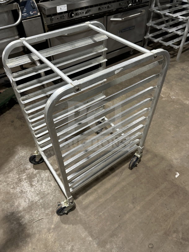 Commercial stainless steel small-size heavy duty bun pan rack on casters, with multiple shelves, moderate wear.