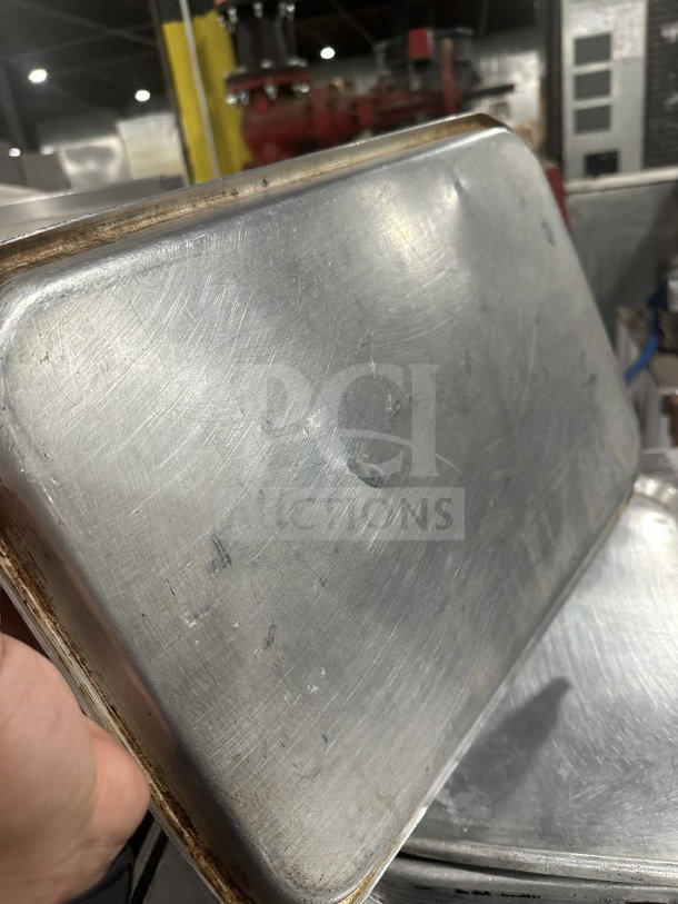 Commercial heavy-duty stainless steel display tray, showing signs of wear and scratches, dimensions 27 inches.