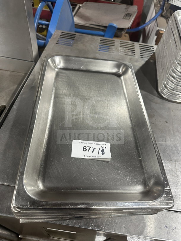 Commercial heavy-duty stainless steel anti-jam full-size hotel steam table food pan in good condition, auction label visible.