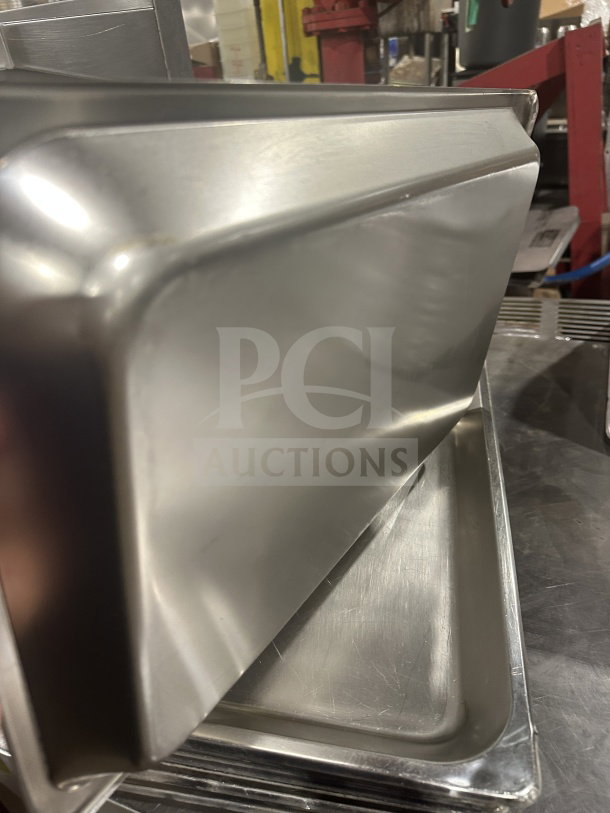 Commercial heavy-duty stainless steel full-size food pan, anti-jam design, excellent condition; ideal for hotel steam tables.