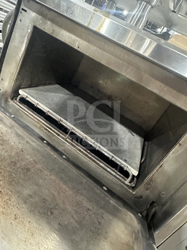 TurboChef NGC high-speed rapid cook oven, stainless steel, electric, countertop model with digital controls, on legs.