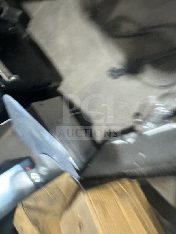 Blurry image of TurboChef NGC commercial stainless steel rapid cook oven with digital controls and legs.