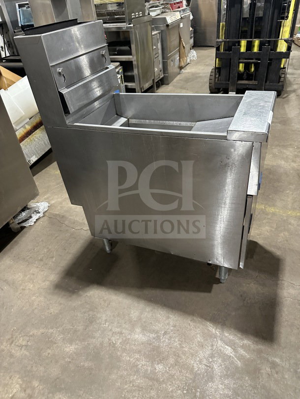 Pitco SG14 commercial stainless steel gas fryer, 40 lb capacity, with backsplash, on legs, serial G16AD001098.