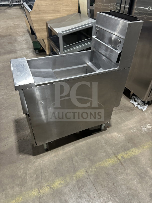 Pitco SG14 commercial stainless steel gas fryer, 40 lb. capacity, with backsplash on legs. Model SN: G16AD001098.