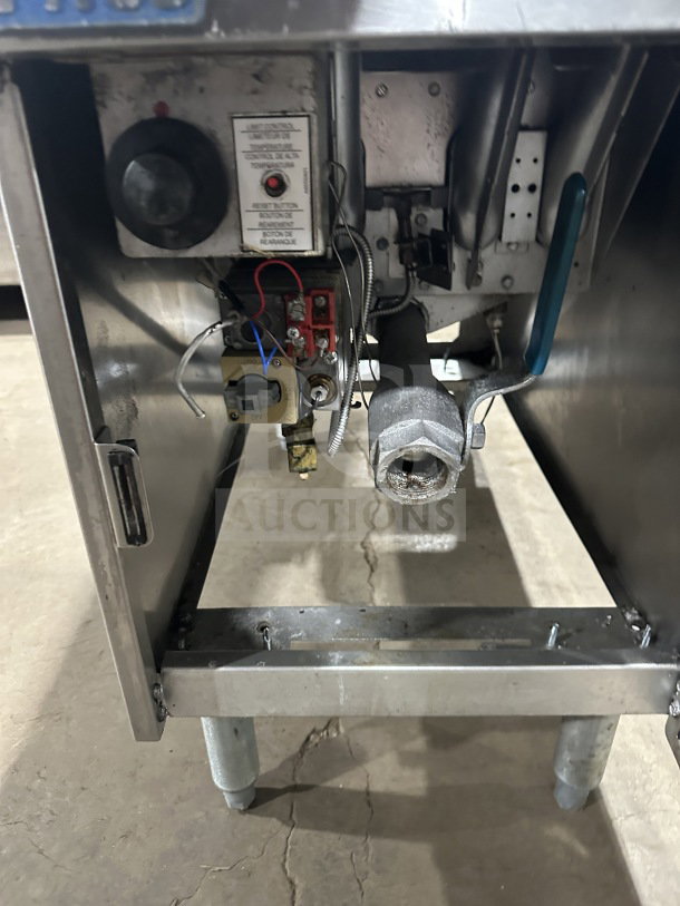 Pitco SG14 commercial stainless steel gas fryer, 40 lb capacity, with backsplash, on legs, visible controls and wiring.