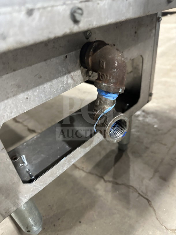 Pitco SG14 commercial stainless steel gas-powered deep fryer, 40 lb capacity, with visible gas connection fittings, on legs.