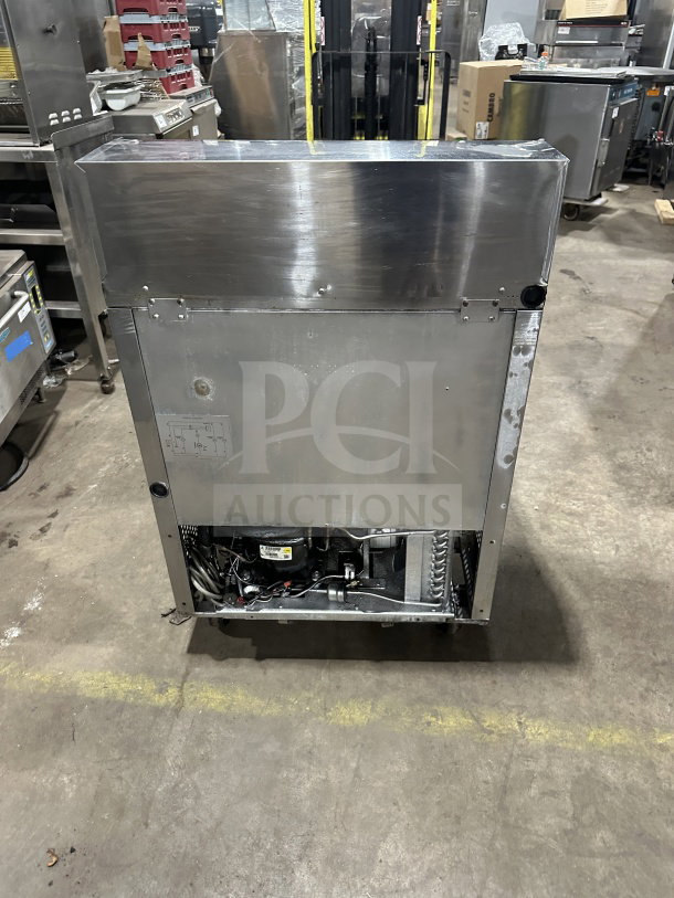 Turbo Air MST-28 refrigerated prep table, stainless steel, single door, poly-coated rack, 115V, on casters, commercial use.