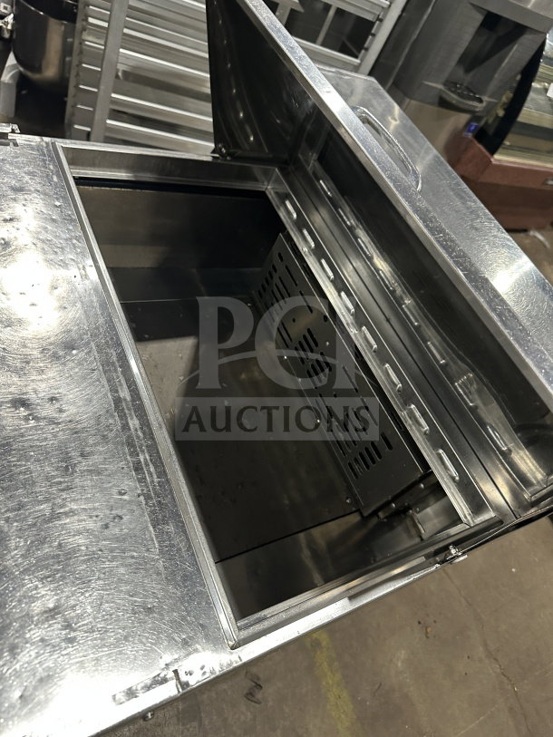 Turbo Air MST-28 refrigerated prep table, stainless steel, single door, bain marie style, includes poly coated rack, on casters.