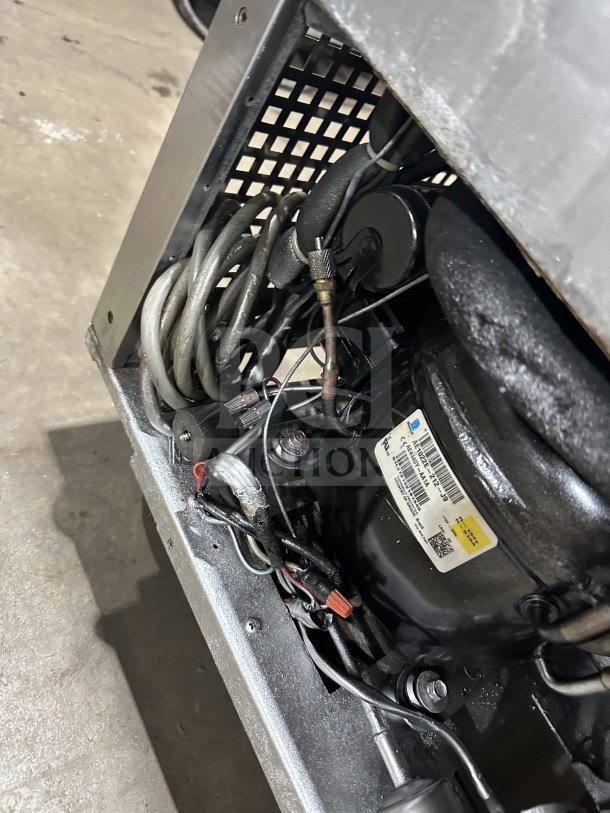 Turbo Air M3 Series MST-28 refrigerated prep table wiring and components, features poly-coated rack and sits on casters.