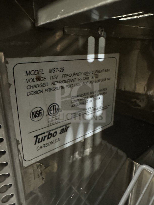 Turbo Air Commercial Stainless Steel MST-28 refrigerated prep table label, 115V, with poly coated wired rack, on casters.