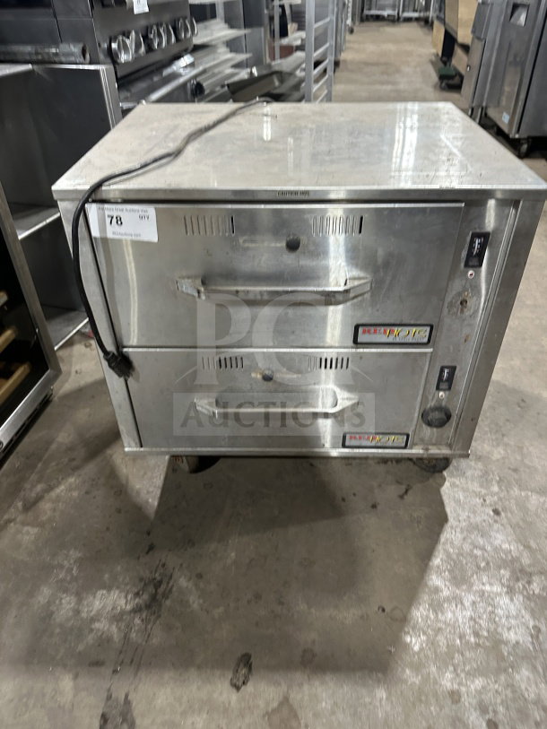 Eagle Group RedHots DWW-2-120 double warming drawer, stainless steel, electric, on casters, used condition, model label visible.