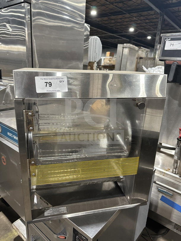 Prince Castle Model 413 stainless steel electric corn carousel, SN: 102, 115V, in good condition with visible auction label.