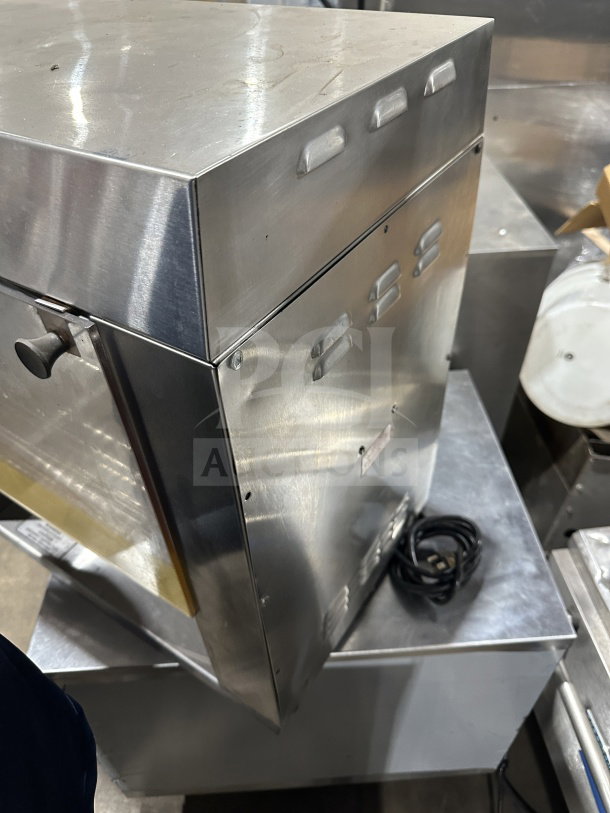Prince Castle Model 413 stainless steel electric corn carousel, 115V, with visible power cord. Condition appears used. Serial number 102.
