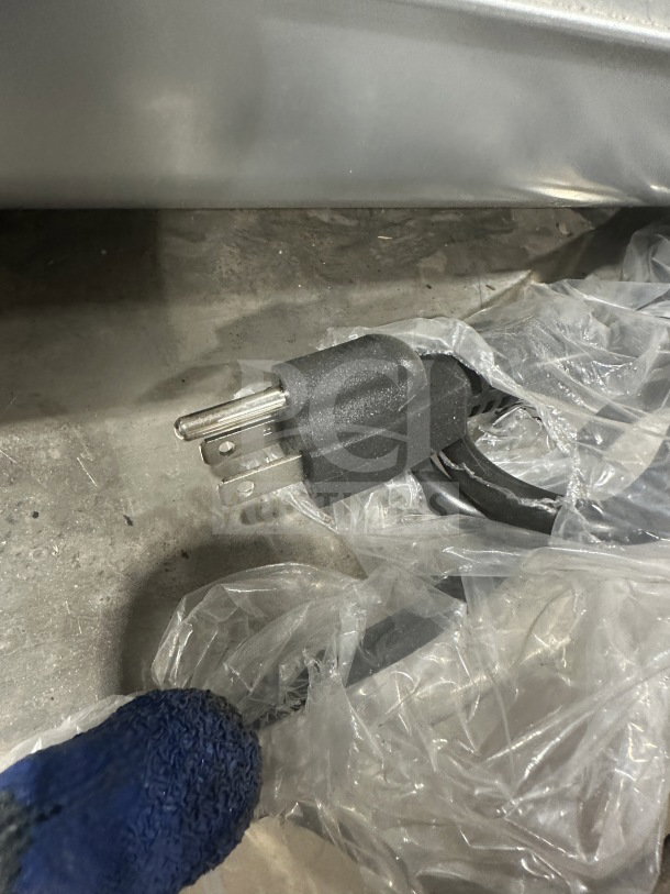 Power cord for Marchia MSU140S Commercial Sushi Merchandiser, shown in clean, new condition with protective plastic wrap.