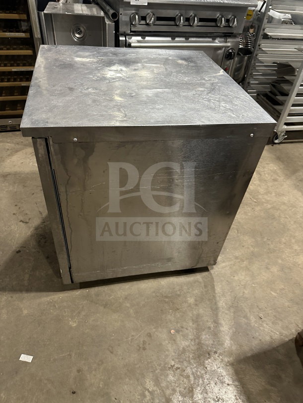 Delfield Enodis Series stainless steel undercounter refrigerator, model 406STAR2, with poly-coated rack, on casters.