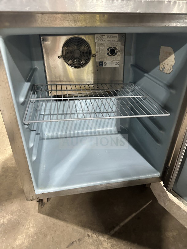 Delfield Enodis Series stainless steel undercounter refrigerator, model 406STAR2, with poly-coated rack and casters, SN: 0708152003224.