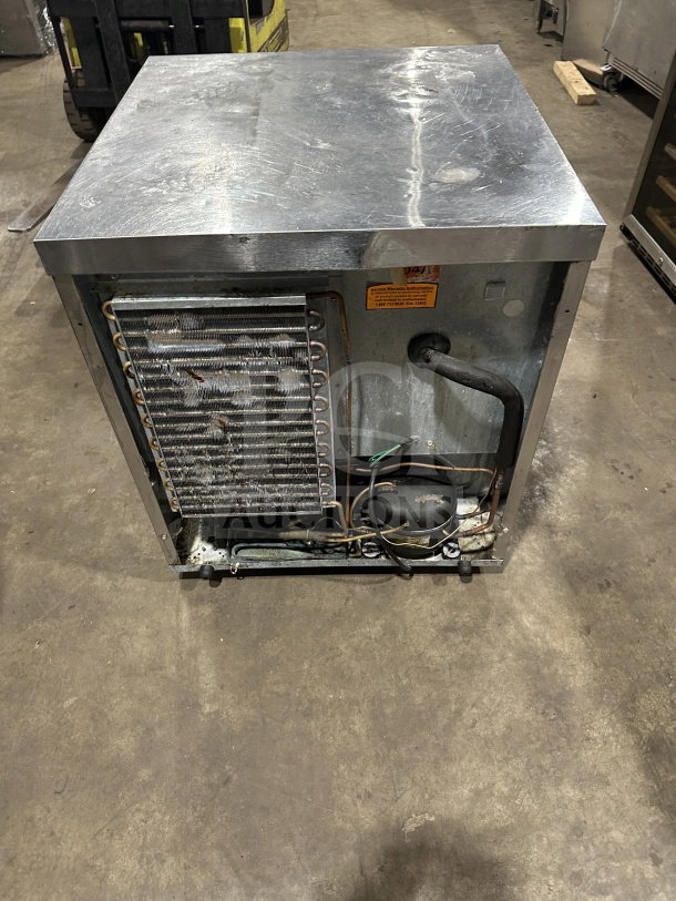 Delfield Enodis Series undercounter worktop refrigerator, Model 406-STAR2, stainless steel, on casters, 115V, wiring visible.