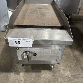 Commercial stainless steel gas-powered countertop flat top griddle on legs. Features a control knob. Used condition.