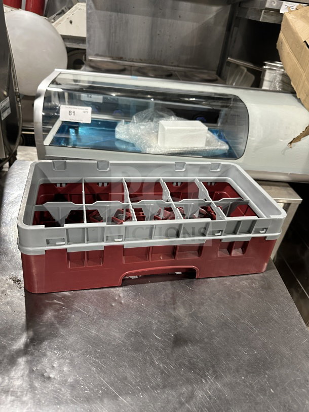 Commercial Cranberry Camrack glass rack with 10 compartments, 3 5/8" half-size, 1 extender; excellent condition.