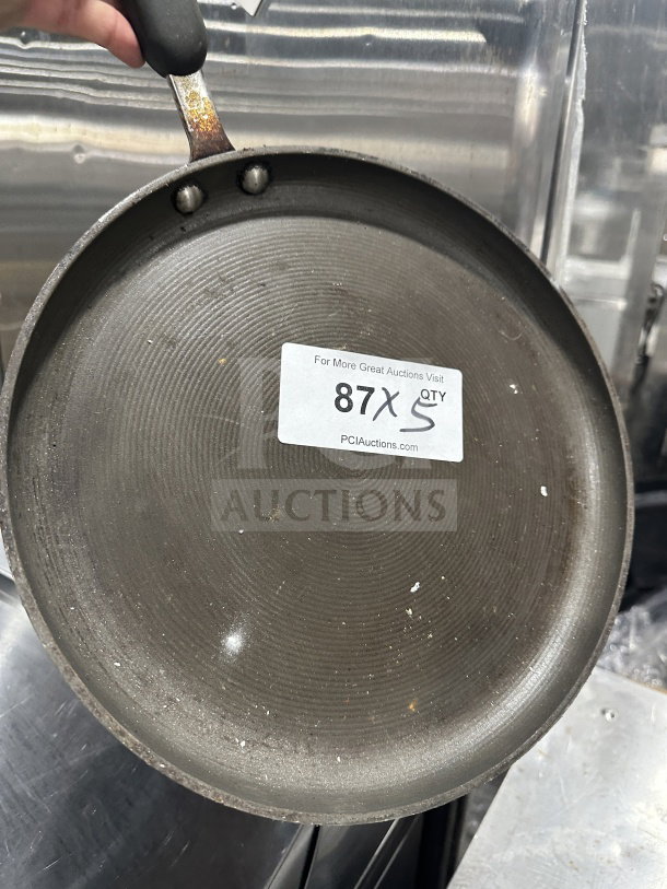 Commercial stainless steel non-stick fry/griddle pan. Features durable handle, used condition. Label reads "87X QTY 5".