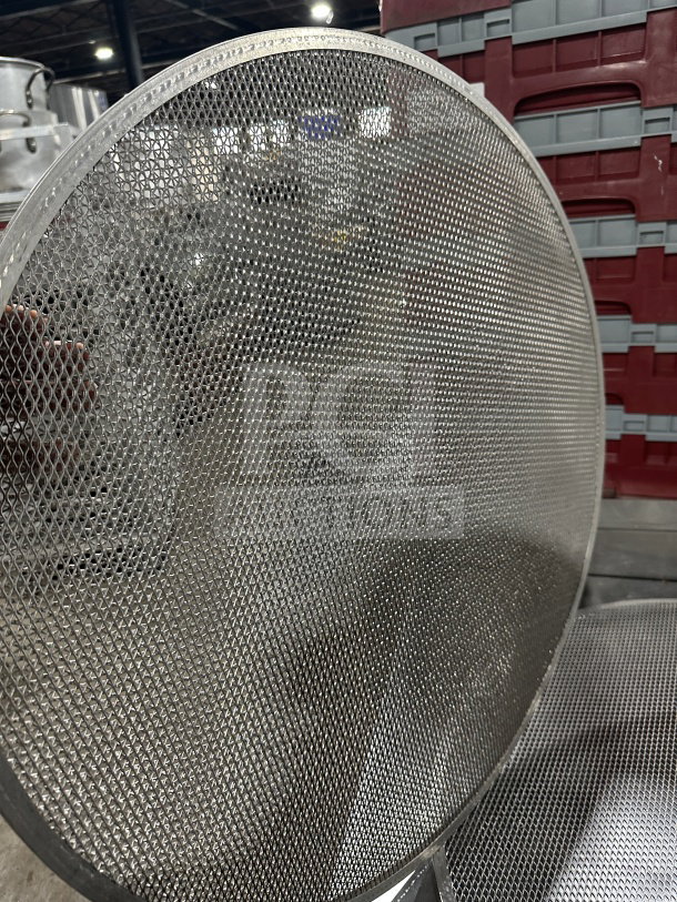Commercial round aluminum pizza baking screen, mesh design, excellent condition, ideal for even baking and heat distribution.