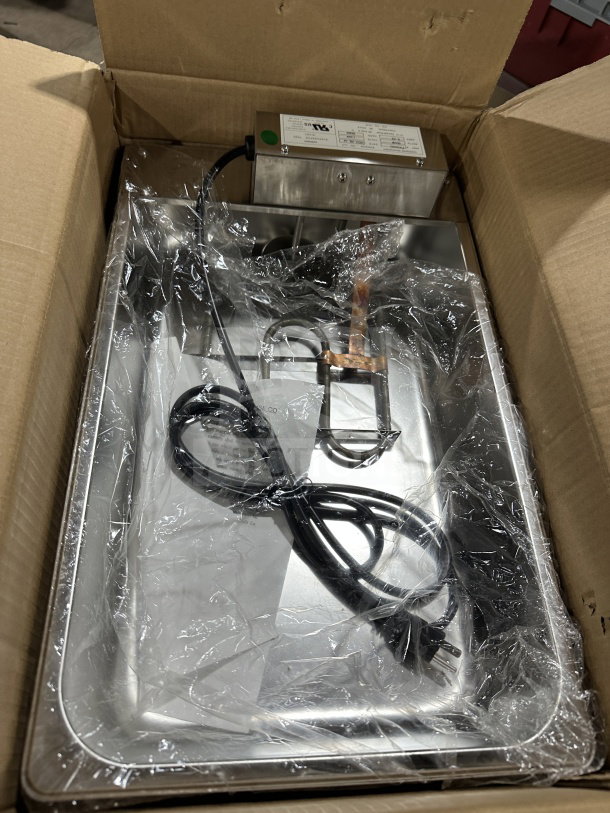 Continental Refrigeration stainless steel evaporator pan, model F412502, in box. New condition, 120V electric powered.
