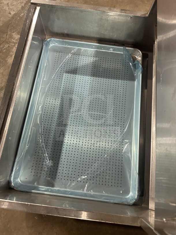 Carter Hoffmann CNH28 stainless steel fry warming station, countertop model, on legs, with perforated tray, 208V, 1 Phase.
